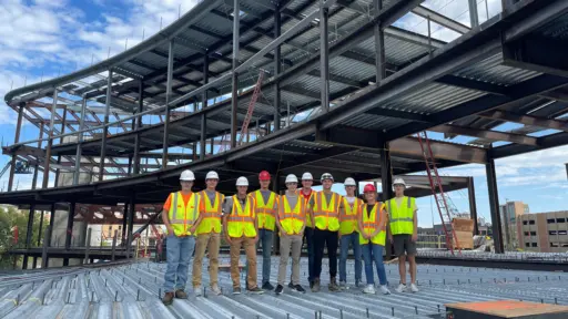 Students on a building construction site.